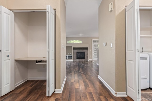 8427 S Hoyt Way Unit 107, Littleton, CO 80128 - hallway featuring dark wood finished floors and washer / dryer