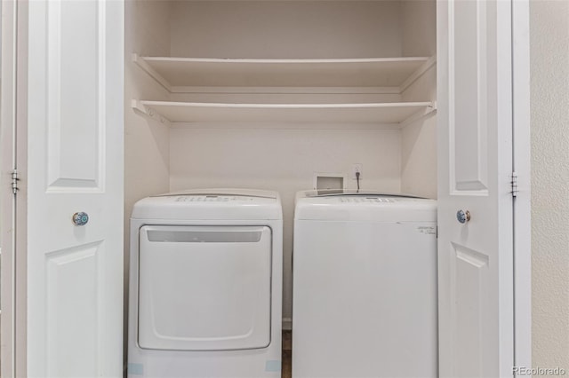 8427 S Hoyt Way Unit 107, Littleton, CO 80128 - laundry area with washer and clothes dryer