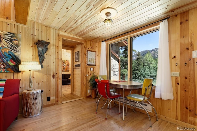 256 Fisk Fenner Rd, Allenspark, CO 80510 - dining space featuring wood walls, wood finished floors, and wood ceiling
