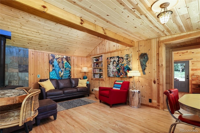256 Fisk Fenner Rd, Allenspark, CO 80510 - living area with wood walls, wood finished floors, wooden ceiling, and a wood stove