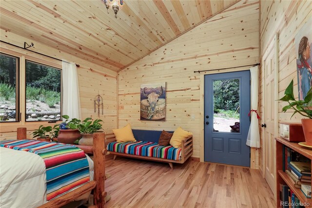 256 Fisk Fenner Rd, Allenspark, CO 80510 - bedroom featuring vaulted ceiling, wood ceiling, wooden walls, and wood finished floors