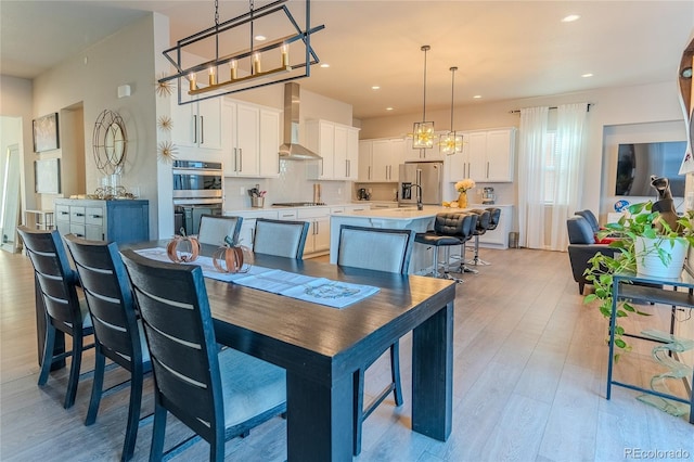 dining room featuring light hardwood / wood-style floors