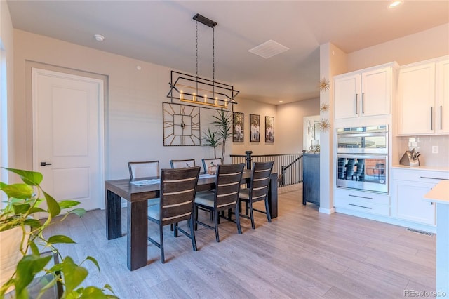 dining space featuring light hardwood / wood-style flooring