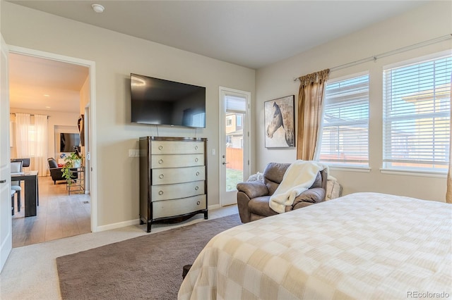 carpeted bedroom featuring access to exterior