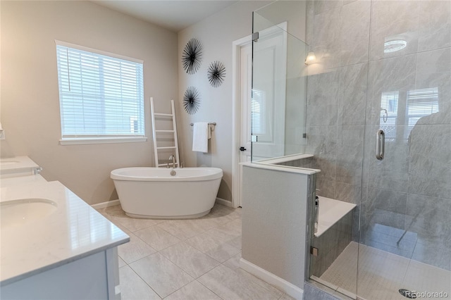 bathroom featuring tile patterned floors, vanity, and plus walk in shower