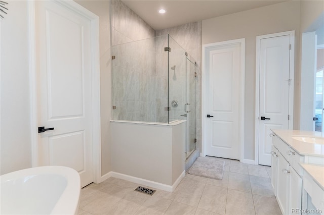 bathroom with vanity, tile patterned floors, and independent shower and bath