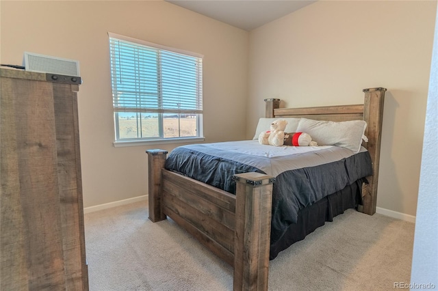 bedroom featuring light carpet