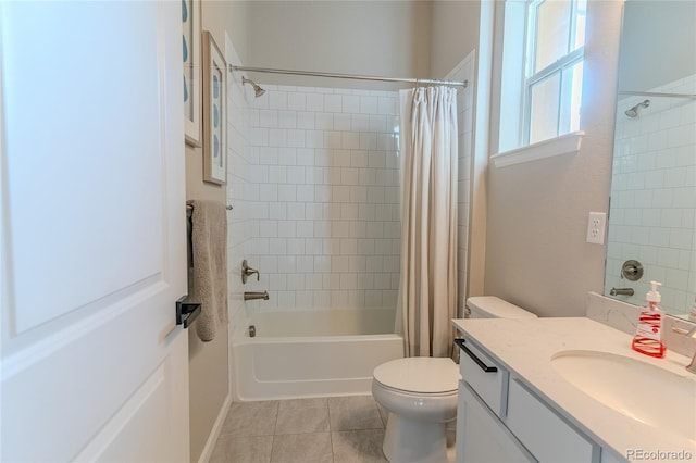 full bathroom featuring tile patterned floors, vanity, toilet, and shower / bath combo with shower curtain