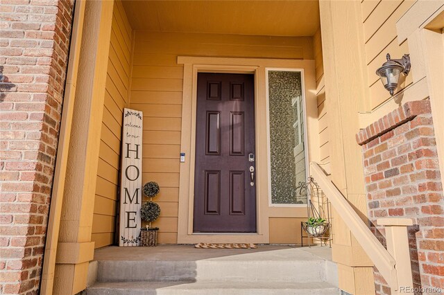 425 W 128th Dr, Westminster, CO 80234 - property entrance featuring brick siding