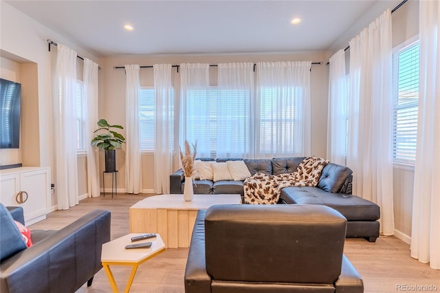 425 W 128th Dr, Westminster, CO 80234 - living area featuring light wood-style floors, healthy amount of natural light, baseboards, and recessed lighting
