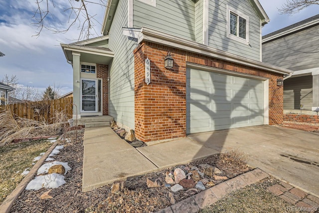 view of exterior entry featuring a garage