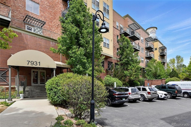 7931 W 55th Ave Unit 105, Arvada, CO 80002 - view of apartment building / complex with uncovered parking