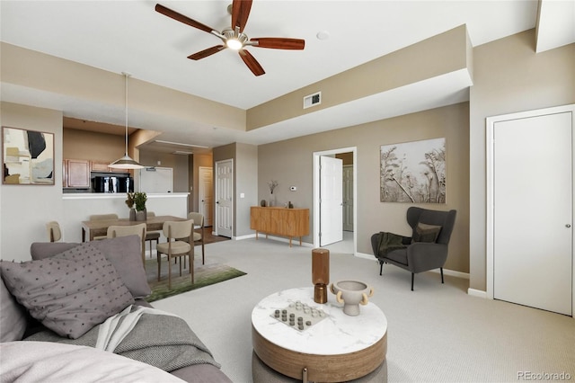 7931 W 55th Ave Unit 105, Arvada, CO 80002 - living area featuring light colored carpet and ceiling fan