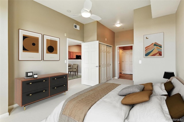 7931 W 55th Ave Unit 105, Arvada, CO 80002 - bedroom with light carpet, a closet, and ceiling fan