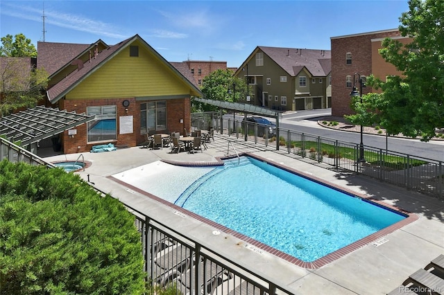 7931 W 55th Ave Unit 105, Arvada, CO 80002 - community pool featuring a patio and a residential view
