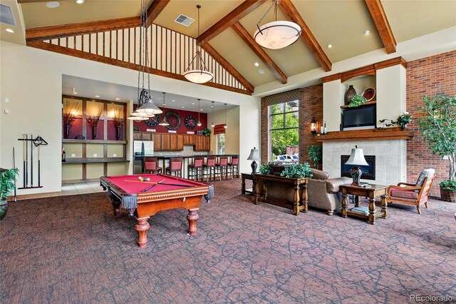 7931 W 55th Ave Unit 105, Arvada, CO 80002 - playroom with high vaulted ceiling, carpet floors, beamed ceiling, billiards table, and a fireplace