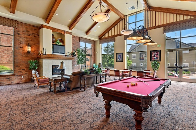 7931 W 55th Ave Unit 105, Arvada, CO 80002 - recreation room featuring high vaulted ceiling, beam ceiling, a fireplace, billiards table, and carpet