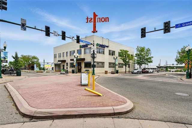7931 W 55th Ave Unit 105, Arvada, CO 80002 - view of asphalt street featuring traffic lights, street lighting, curbs, and sidewalks