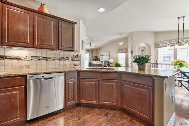 kitchen featuring ceiling fan, sink, stainless steel dishwasher, kitchen peninsula, and lofted ceiling