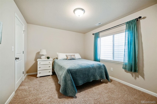 bedroom featuring light carpet