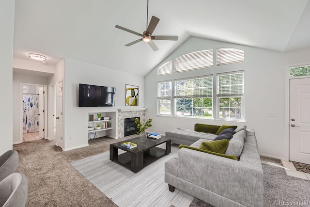 living room featuring lofted ceiling, carpet, and ceiling fan