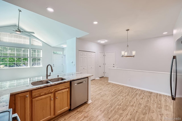 kitchen with ceiling fan with notable chandelier, stainless steel appliances, sink, lofted ceiling, and light wood-type flooring