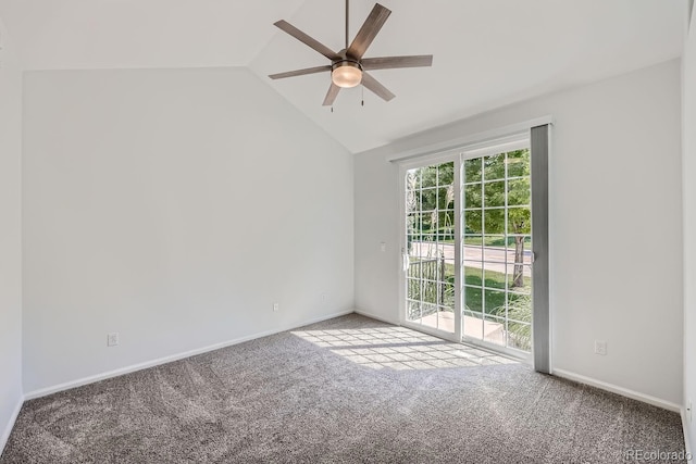 empty room featuring lofted ceiling, carpet, and ceiling fan