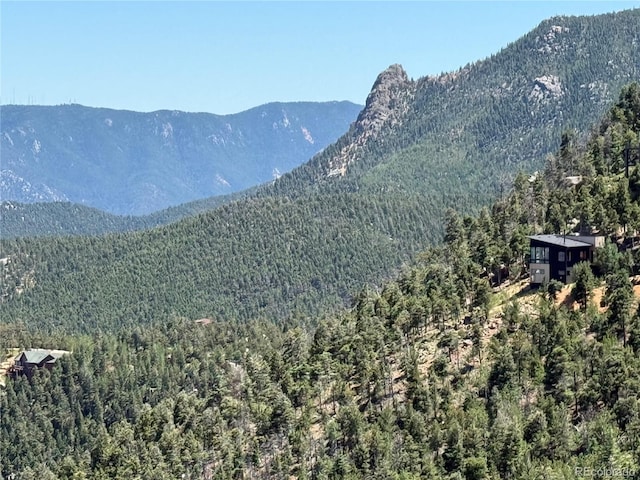 555 Sunrise Peak Rd, Manitou Springs, CO 80829 - mountain view with a heavily wooded area