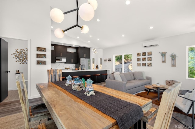 555 Sunrise Peak Rd, Manitou Springs, CO 80829 - dining space with an AC wall unit, recessed lighting, lofted ceiling, and light wood-style floors