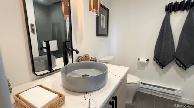 555 Sunrise Peak Rd, Manitou Springs, CO 80829 - bathroom with baseboard heating, vanity, and tile patterned floors