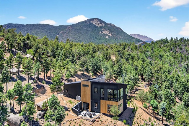 555 Sunrise Peak Rd, Manitou Springs, CO 80829 - view of mountain backdrop with a forest