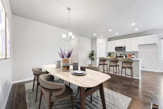 3548 Swabuck Pl, Castle Rock, CO 80109 - dining space with baseboards, recessed lighting, dark wood-type flooring, and a chandelier