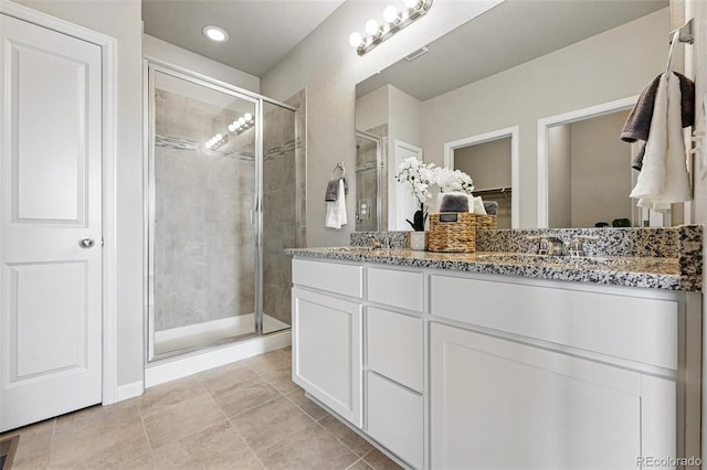 3548 Swabuck Pl, Castle Rock, CO 80109 - full bath with a stall shower, double vanity, and tile patterned floors