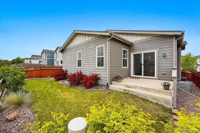 3548 Swabuck Pl, Castle Rock, CO 80109 - back of property featuring board and batten siding and a patio