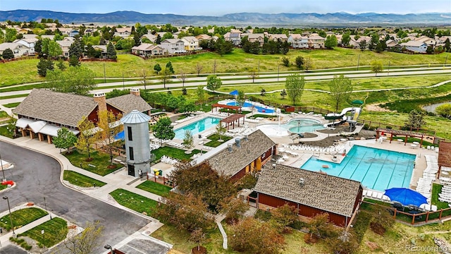 3548 Swabuck Pl, Castle Rock, CO 80109 - aerial perspective of suburban area featuring a pool area and a mountain backdrop