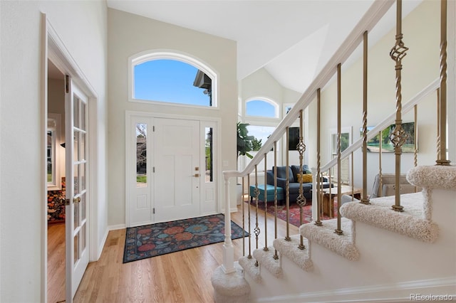 25 Sand Cherry, Littleton, CO 80127 - entrance foyer with stairway, wood finished floors, and high vaulted ceiling