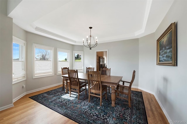 25 Sand Cherry, Littleton, CO 80127 - dining area with a raised ceiling, a chandelier, and wood finished floors