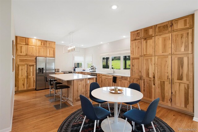 25 Sand Cherry, Littleton, CO 80127 - dining room featuring light wood-style flooring, recessed lighting, and a chandelier