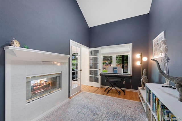 25 Sand Cherry, Littleton, CO 80127 - office with high vaulted ceiling, wood finished floors, and a tiled fireplace