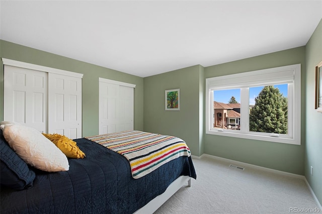 25 Sand Cherry, Littleton, CO 80127 - carpeted bedroom featuring multiple closets and baseboards