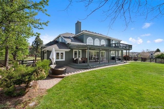 25 Sand Cherry, Littleton, CO 80127 - back of property with a chimney, a deck, an outdoor hangout area, and a pergola