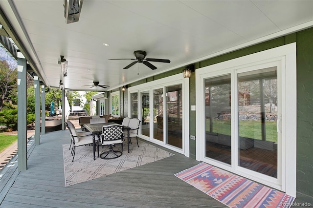 25 Sand Cherry, Littleton, CO 80127 - wooden deck featuring outdoor dining area and a ceiling fan