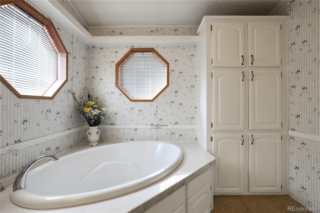 bathroom with a tub to relax in