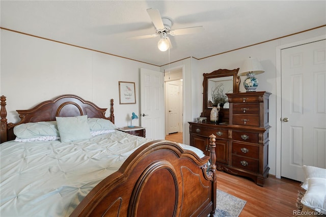 bedroom with ceiling fan and light hardwood / wood-style flooring