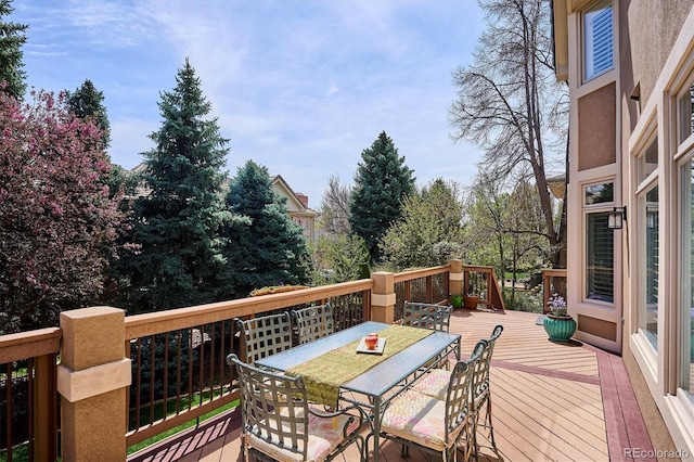 deck featuring outdoor dining area