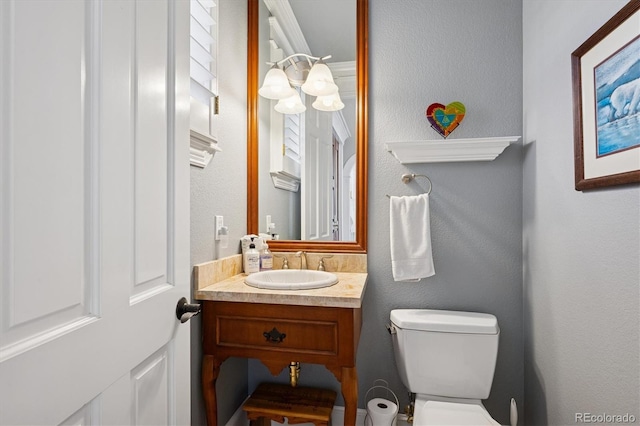half bath with vanity and toilet
