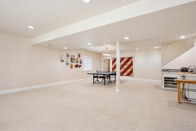 playroom featuring baseboards, light carpet, and recessed lighting