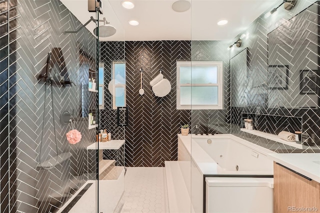 full bathroom featuring tiled shower and a whirlpool tub