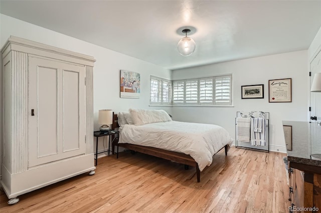 bedroom featuring light wood finished floors