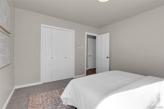 bedroom with a closet and carpet floors